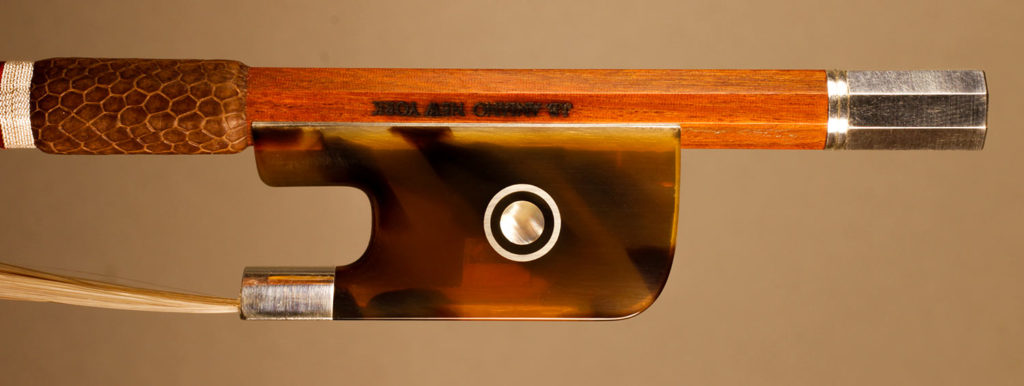 Cello Bow silver-mounted Faux Tortoiseshell frog with Parisian eyes and solid button.