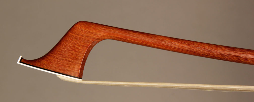 Cello Bow with a round pernambuco stick, silver-mounted Faux ebony frog with Parisian eyes and solid button.