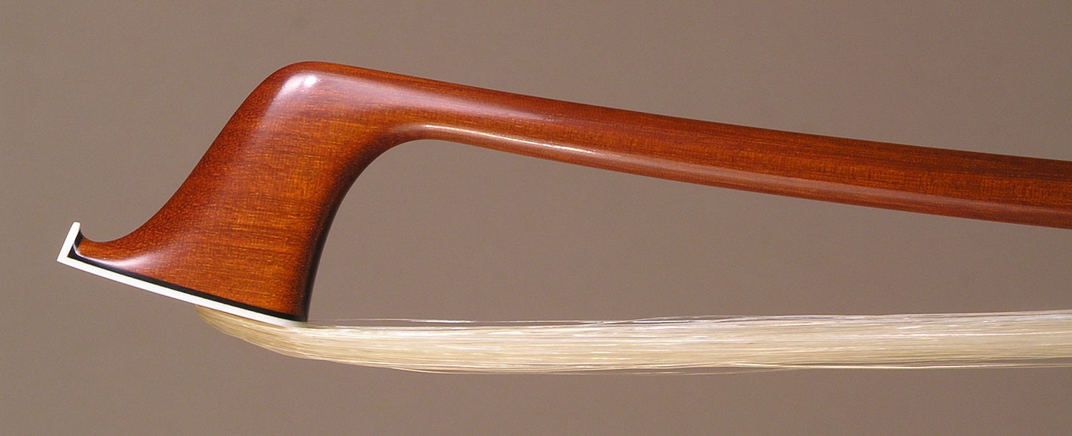 Cello Bow with a round pernambuco stick, gold-mounted ebony frog with double pearl eyes and divided button.