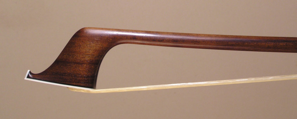 Cello Bow with a round wamara stick, silver-mounted ebony frog with plain eyes and divided button.