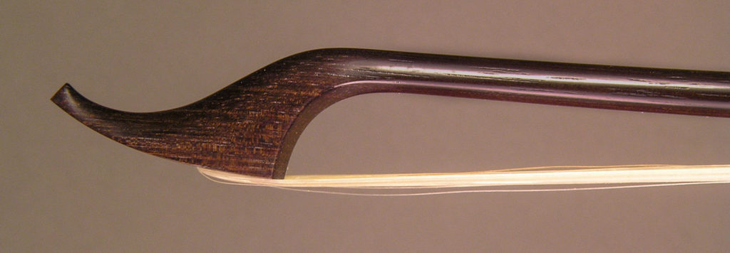 Classical Cello Bow with round bannia (Swartzia bannia) stick, open trench ebony frog and greenheart button.