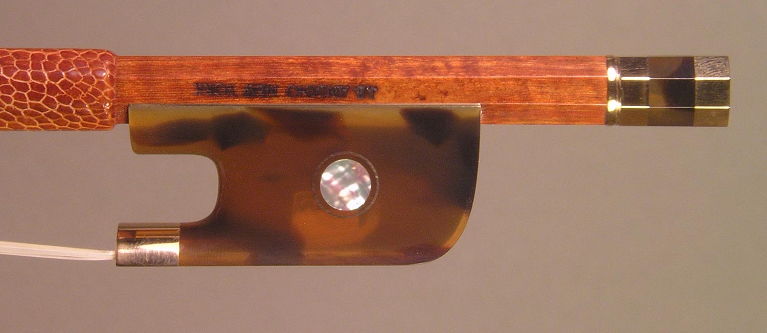 Viola Bow with a round pernambuco stick, gold-mounted Faux Tortoiseshell frog with Parisian eyes and divided button.