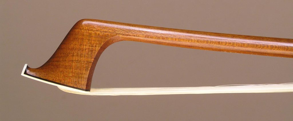 Viola Bow with a round Ipe (Tabebuia species) stick, silver-mounted ebony frog with plain pearl eyes and divided button.