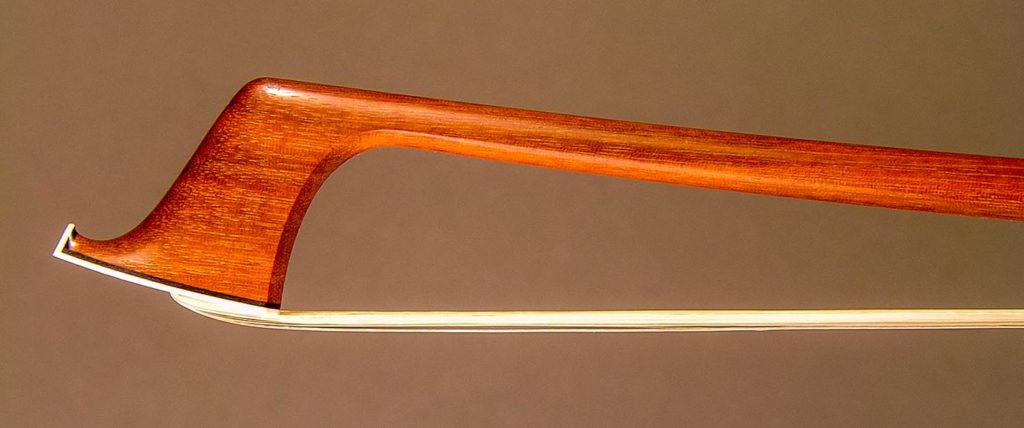 Violin Bow with a round pernambuco stick, silver-mounted faux tortoiseshell frog with Parisian eyes and divided button