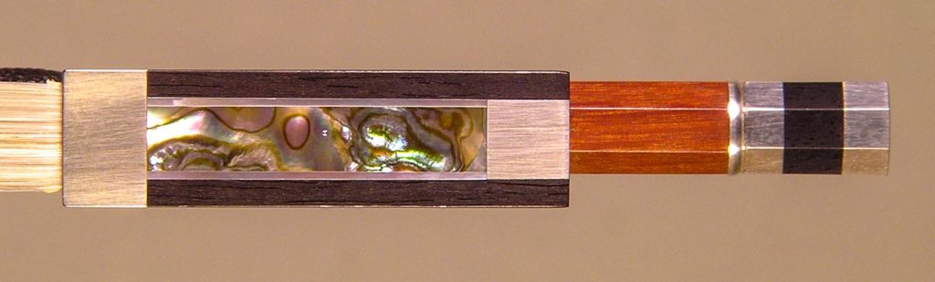Violin Bow w/silver-mounted ebony frog showing double pearl slide detail.